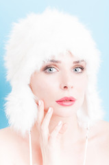 Perfect woman skin wearing daytime makeup and fur hat