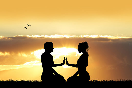 Couple Doing Yoga At Sunset