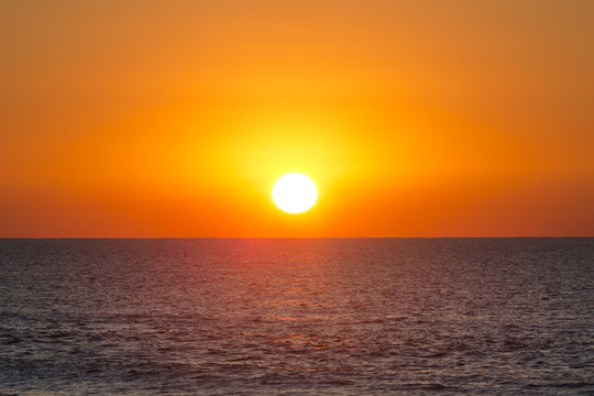 bright sunset over the Mediterranean sea