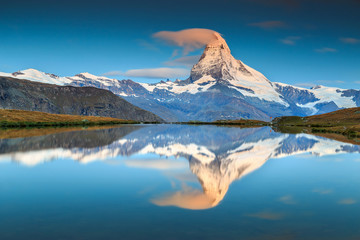 Magical sunrise with Matterhorn peak and Stellisee lake,Valais,Switzerland - obrazy, fototapety, plakaty