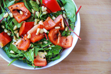 healthy and easy made spinach green leaves paprika pine nuts salad with balsamic vinegar and extra virgin olive oil