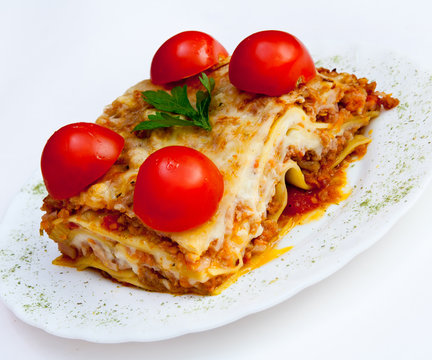 lasagna and 4 tomato on a white background