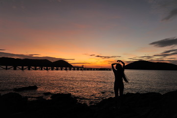 Fototapeta premium woman on beach in twilight