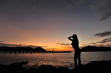 Fototapeta premium woman on beach in twilight
