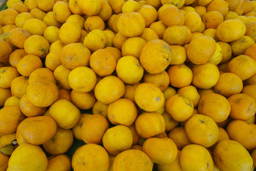 Closeup of oranges on a market.
