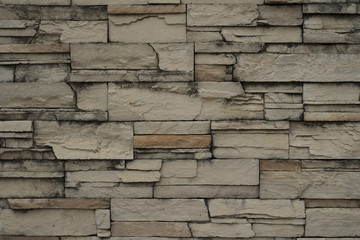 Modern slab stone wall as background.
