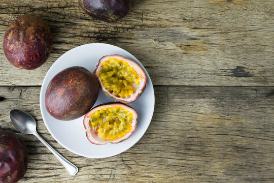 passion fruit on white plate.