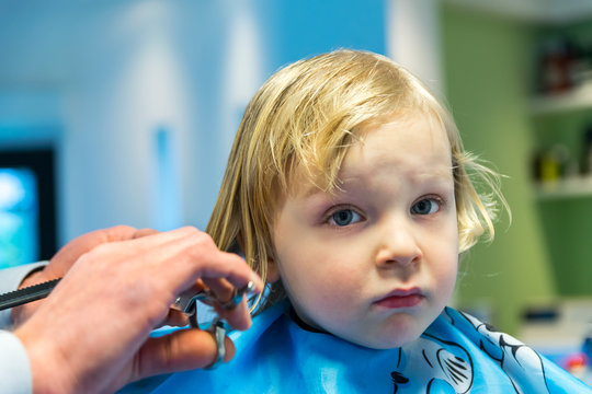 Little boy at the barbershop