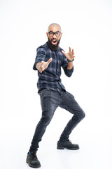 Fototapeta premium Funny baldheaded young african american man showing karate kick