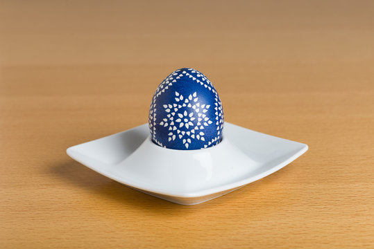 Sorbian Easter egg sitting in white egg cup