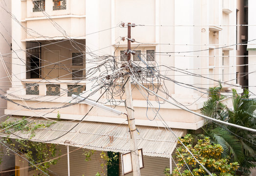Electric cables on the electricity pillar in India