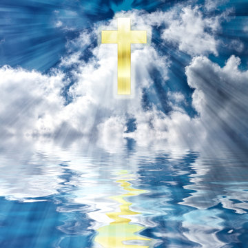 Easter Christian Holiday image of golden cross in the heavens with bursts of lights beams towards water reflecting the cross.  Concept:  He is Risen - Resurrection