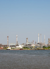 Obraz na płótnie Canvas Landscape of Thai Refinery industrial plant from opposite's side of Chao Phra Ya river 