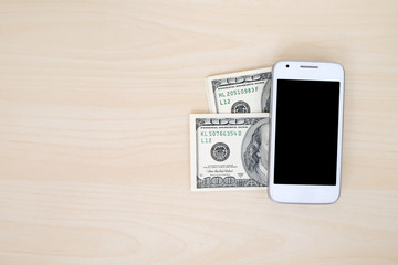 Smart phone and dollar bills, mobile payment concept