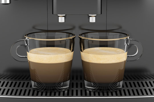 two cups with coffee standing on black coffee machine