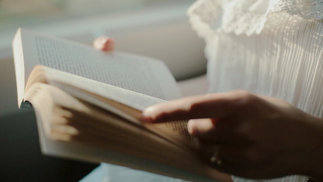 Reading book in a moving train