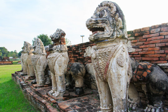 Antique Stupa surrounded by Lion statue cambodia style in Thammikarat Temple in Ayutthaya, Thailand