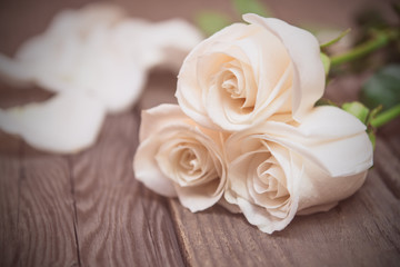 Fototapeta na wymiar White roses on a dark wooden background. Women' s day, Valentine