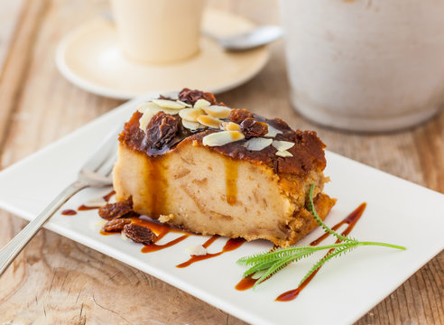 A dessert of bread pudding with caramel sauce