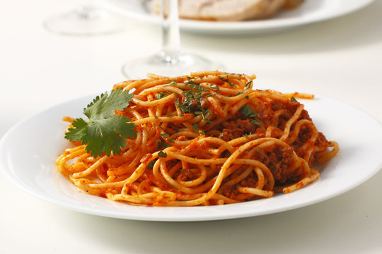 A dish of spaghetti bolognese served on a table