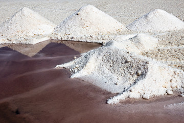 Trapani salt works, salt pile and red water for algal concentrations. Sicily