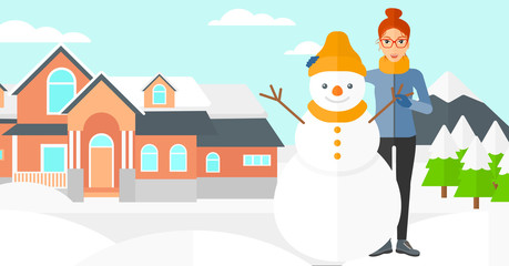 Woman posing near snowman.