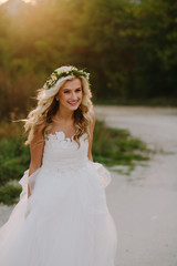 Fototapeta na wymiar Beautiful model girl in a white wedding dress