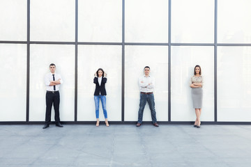 Young business team in front of the modern office building