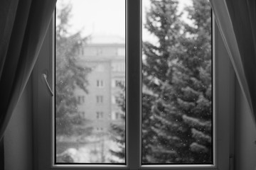 Snowy winter day behind the window