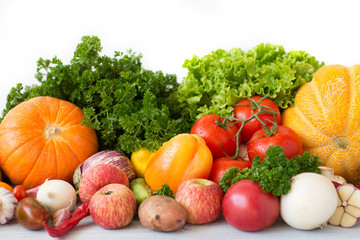 Composition with variety of fresh vegetables and fruits.
