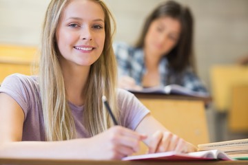 Students sitting beside each other while learning