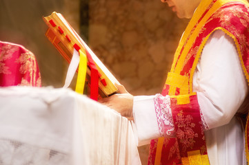 A priest saying the traditional extraordinary tridentine latin rite catholic mass