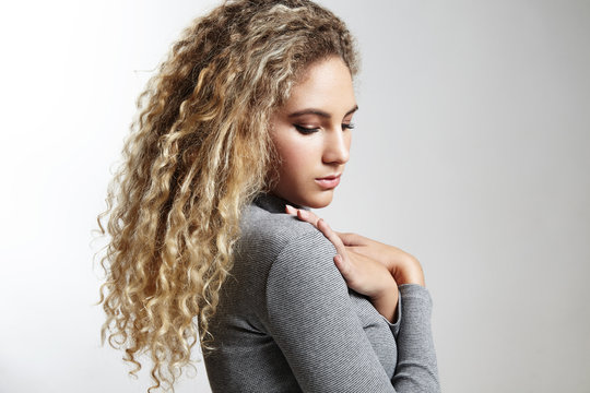 woman with a blond curly hair