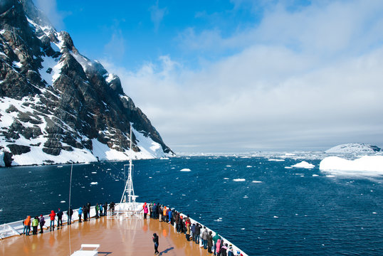 Fototapeta Cruise ship in the waters of Antarctica between mountains and ices