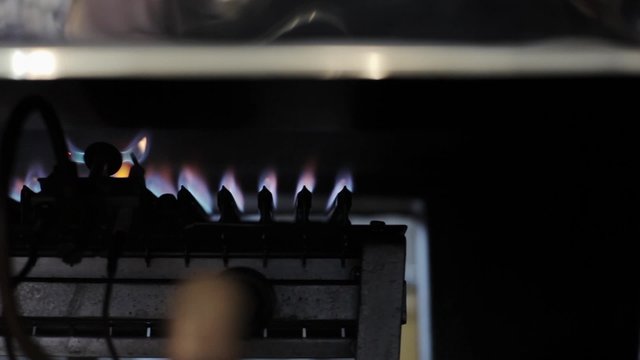Burning stove for frying coffee grains in factory. Close up.