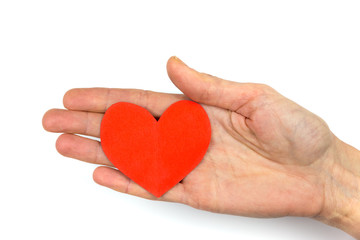 Female hand showing red paper heart as symbol of love