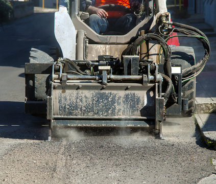 Milling of asphalt for road reconstruction accessory for skid steer