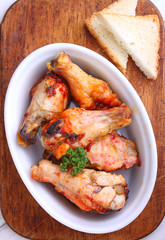 Chicken wings fried with spices in tomato sauce
