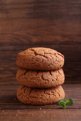 oatmeal cookies on a dark wooden background