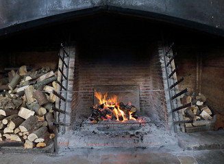 Blazing open Log fire in an Inglenook fireplace