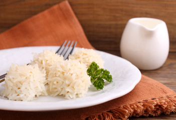 hedgehogs, chicken cutlet with rice on a plate on a dark background