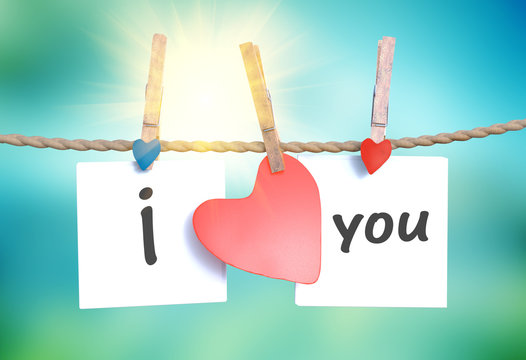 "I love you" hanging on a rope with clothespins