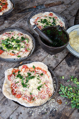 Home made pizza on wooden rustic table