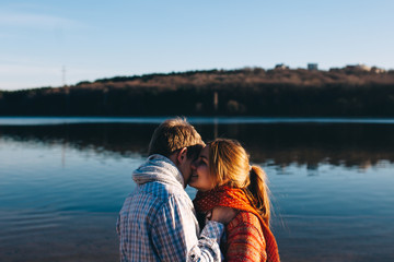 Fototapeta premium Teenage young couple in love at lake