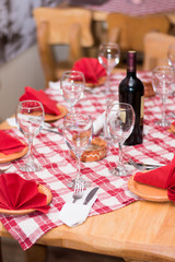 Tavern table setup bottle wine glasses