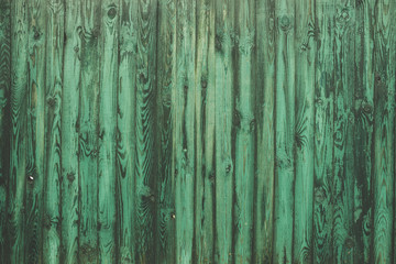 Fototapeta na wymiar Old blue-green surface, fence or guard the background