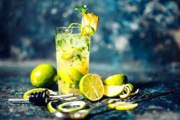 refreshment alcoholic cocktail drink at bar or pub. Gin and lime cocktail with pineapple and ice...