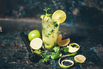 mojito cocktail with lemon and limes garnish. alcoholic drink at bar with vintage effect