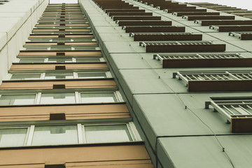 View from the bottom of the window of an apartment house balconies