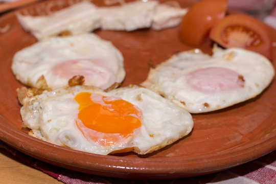 Served fried eggs on the plate